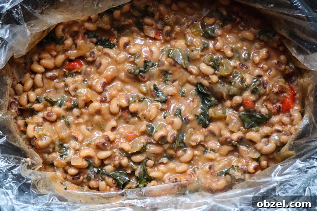 slow cooker with cooked black eyed peas.