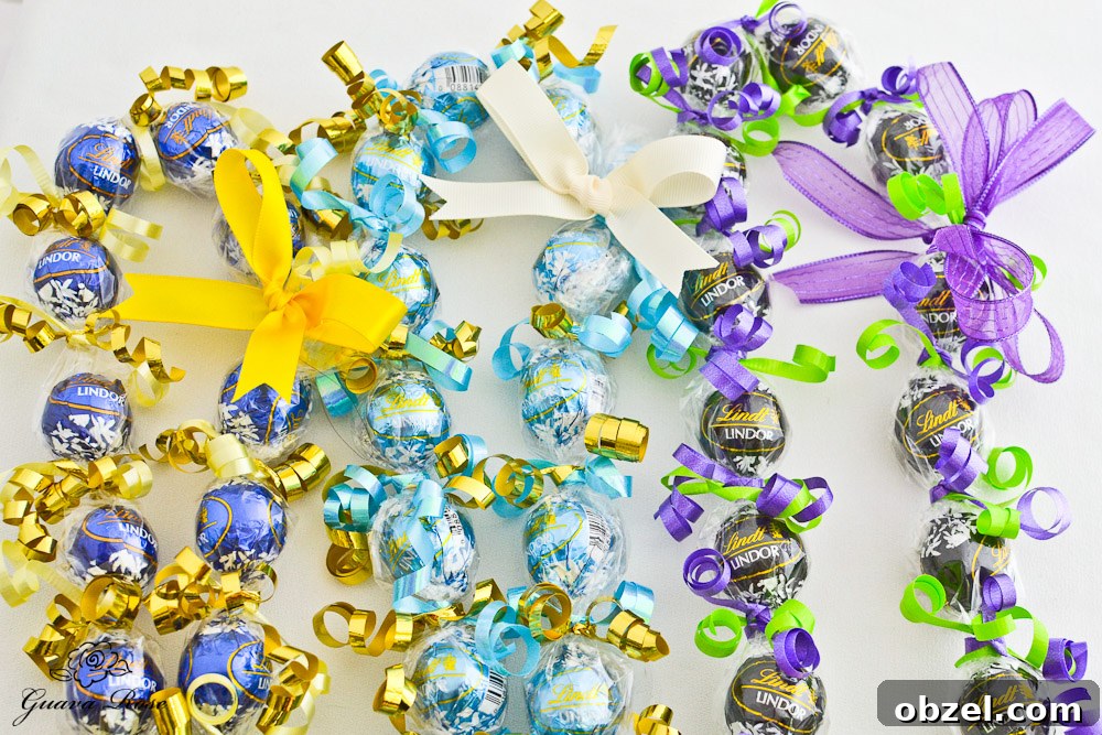 Blue& Gold, Powder Blue & Gold, and Purple & Lime Green Kukui Nut Candy Leis, vertical Blue& Gold, Powder Blue & Gold, and Purple & Lime Green Kukui Nut Candy Leis