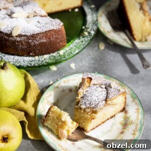 Moist Pear Almond Cake with Fresh Pears 2 A slice of almond pear cake on a plate with a fork