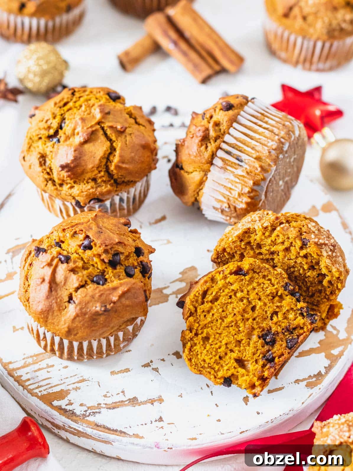 Vegan Pumpkin Muffins with Warm Fall Spices 2 Pumpkin muffins on a white platter
