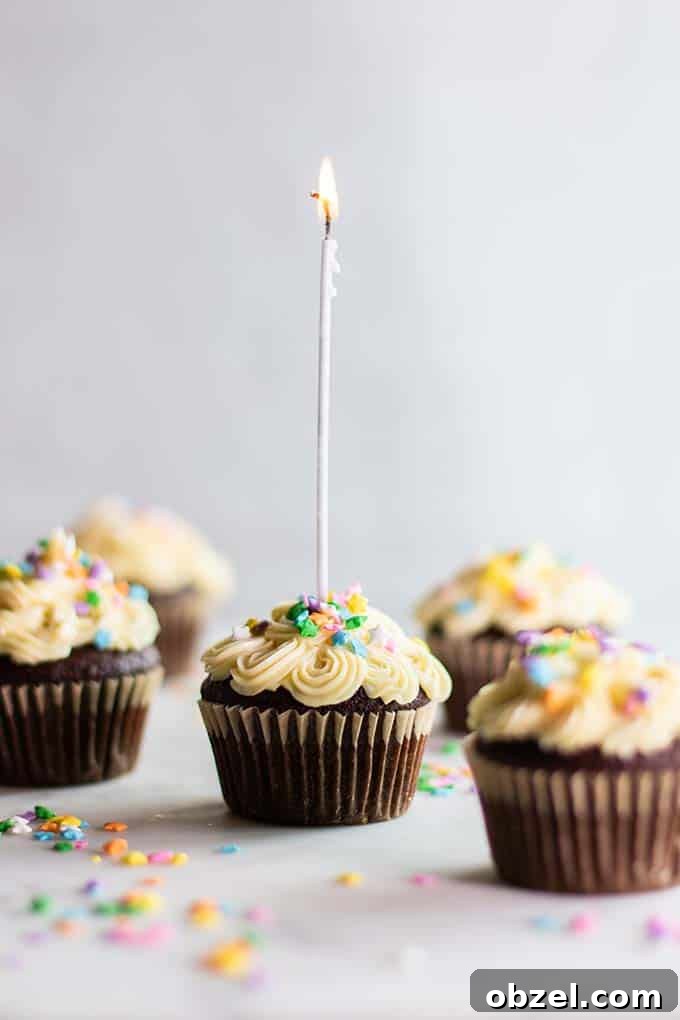 Gluten Free Chocolate Cupcakes Recipe 2 Gluten Free chocolate cupcakes decorated with white buttercream frosting and little colored sprinkles.