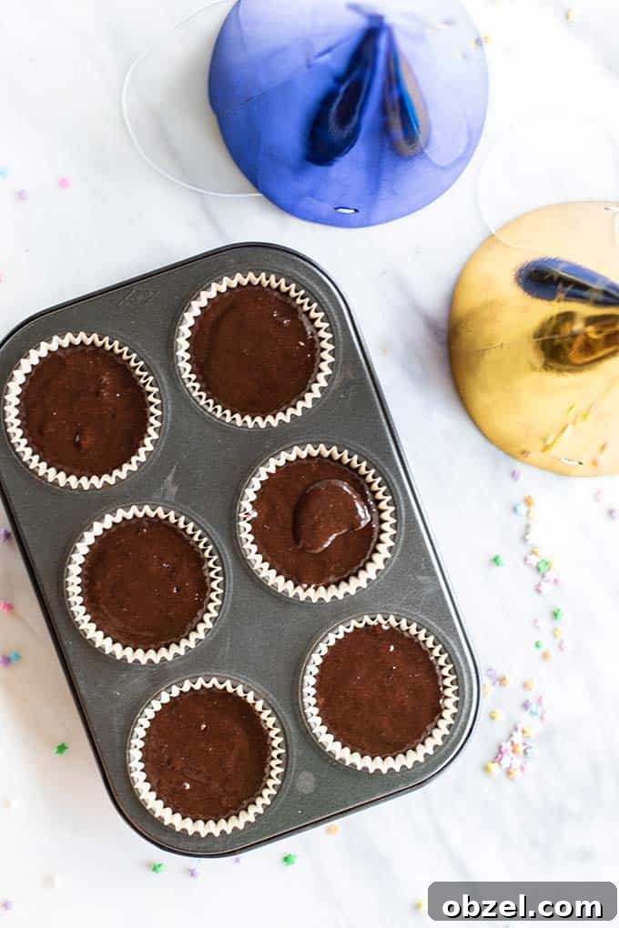 Gluten Free Chocolate Cupcakes Recipe 4 A muffin tin shown with gluten free cupcake batter.