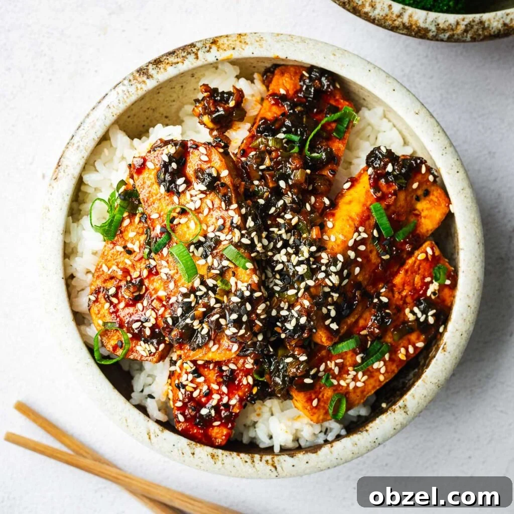 5 Ingredient Thai Green Curry Recipe 14 A rice bowl with extra-firm tofu pan-fried and braised in a spicy gochujang sauce.