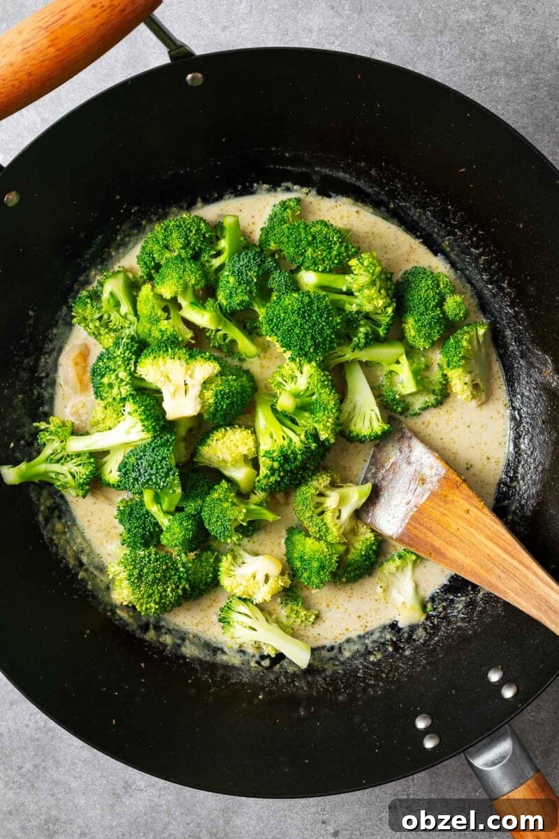 5 Ingredient Thai Green Curry Recipe 8 Raw broccoli added to Thai green curry sauce.
