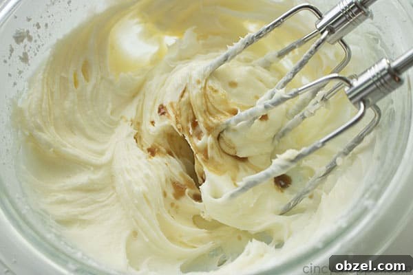 Homemade Cinnamon Rolls Recipe with Cream Cheese Frosting 17 Mixing cream cheese frosting