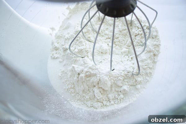 Homemade Cinnamon Rolls Recipe with Cream Cheese Frosting 9 Whisking dry ingredients