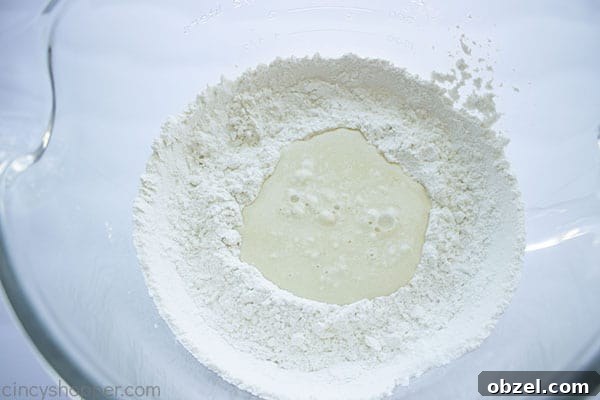 Homemade Cinnamon Rolls Recipe with Cream Cheese Frosting 10 wet mixture added to dry ingredients