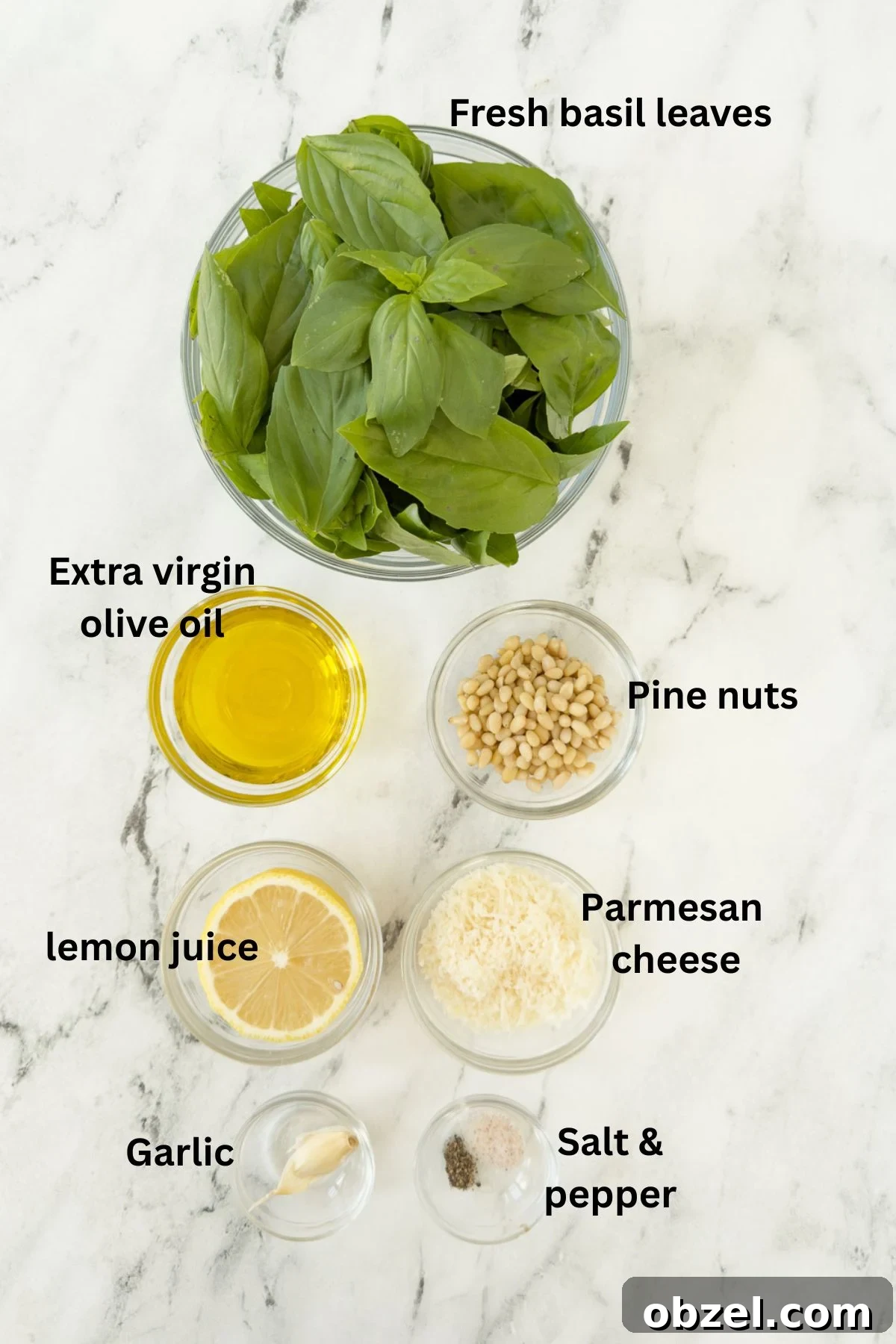 Authentic Pesto alla Genovese Recipe 3 Ingredients for basil pesto on a counter in glass prep bowls.