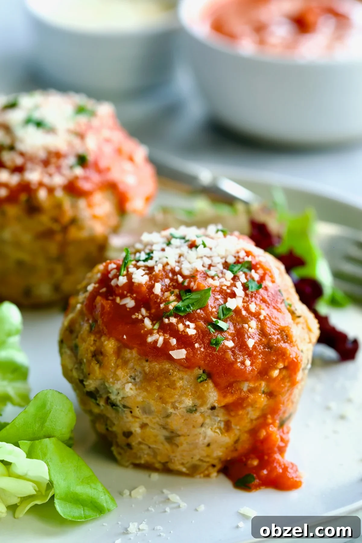 Mini Turkey Meatloaf Muffins Recipe 7 Two Turkey Meatloaf Muffins on white plate.