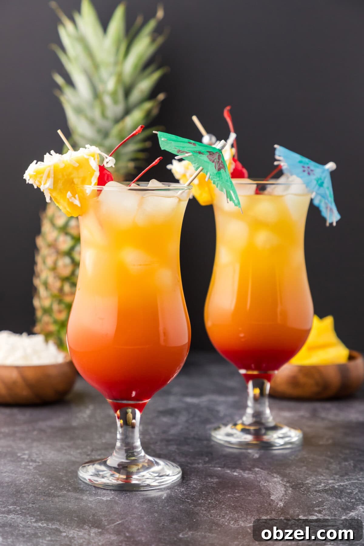 Malibu Sunset: Where to Watch, Photograph and Enjoy 10 Two Malibu Sunset cocktails with a pineapple in the background