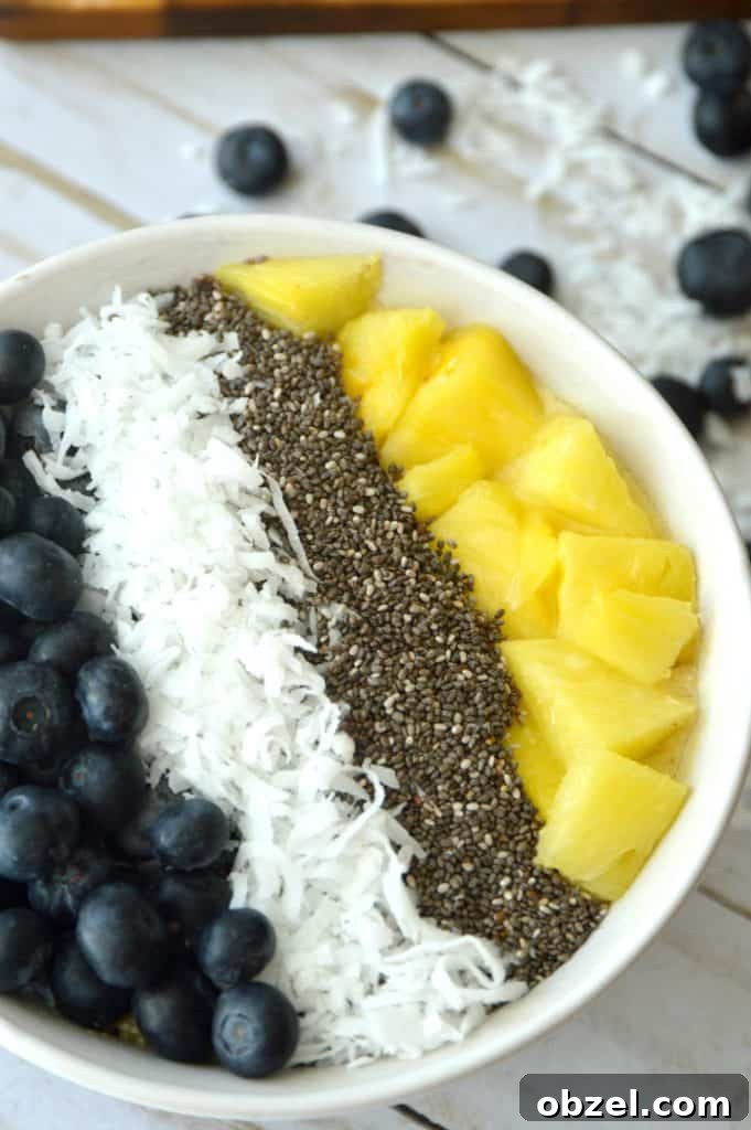 Banana pineapple smoothie bowl with toppings