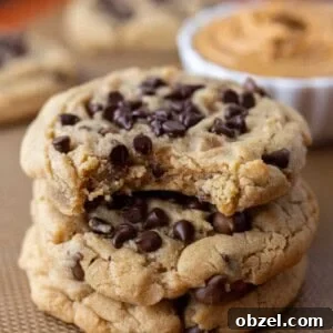 Chewy Peanut Butter Chocolate Chip Cookies 18 Peanut Butter Chocolate Chip Cookies stacked on top of each other
