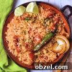 Homemade Mexican Red Rice Recipe 15 closeup image of spanish rice on circular clay plate