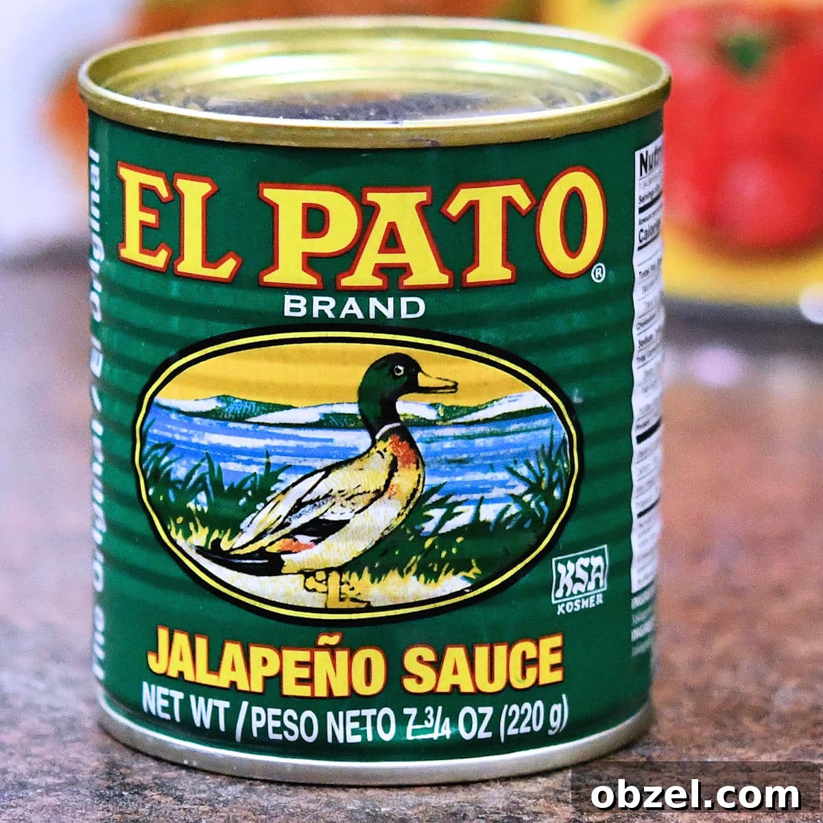 Homemade Mexican Red Rice Recipe 6 A can of El Pato Jalapeno Sauce on a countertop.